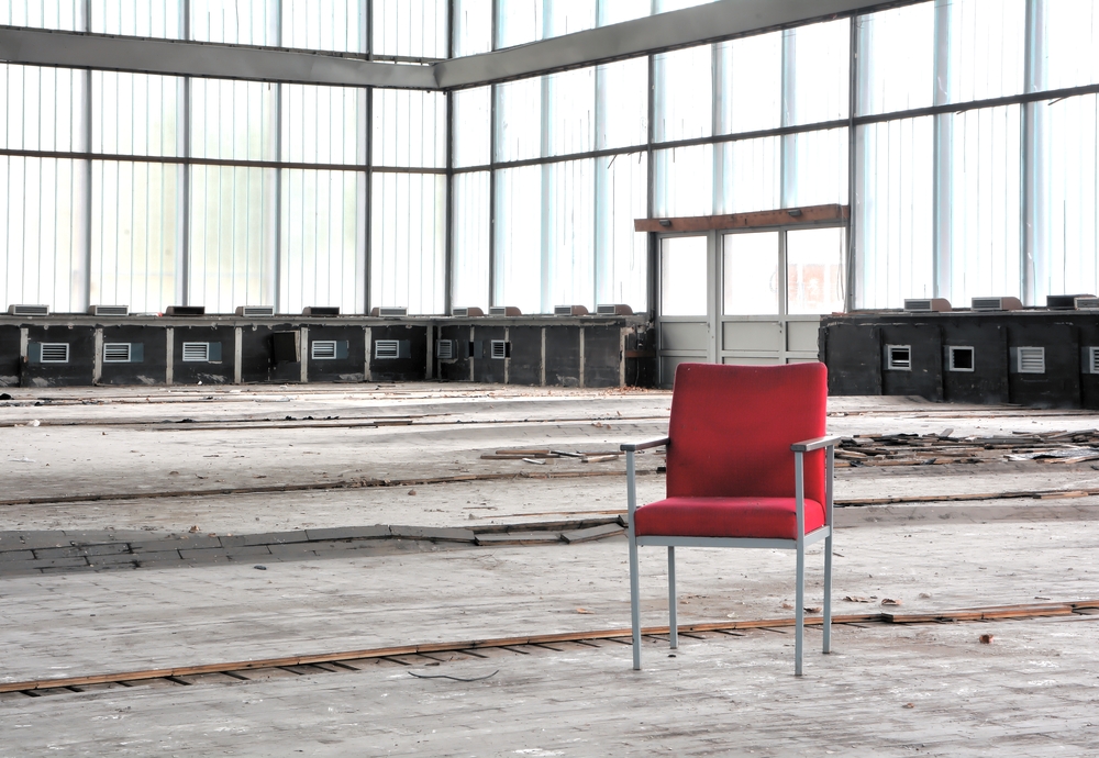 Red,Chair,In,An,Abandoned,Dilapidated,Event,Room