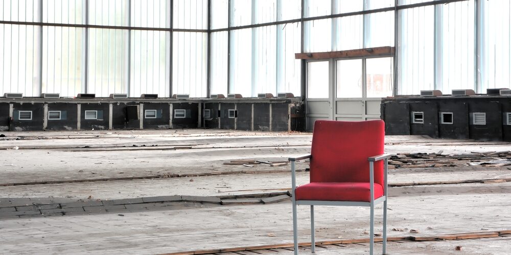 Red,Chair,In,An,Abandoned,Dilapidated,Event,Room